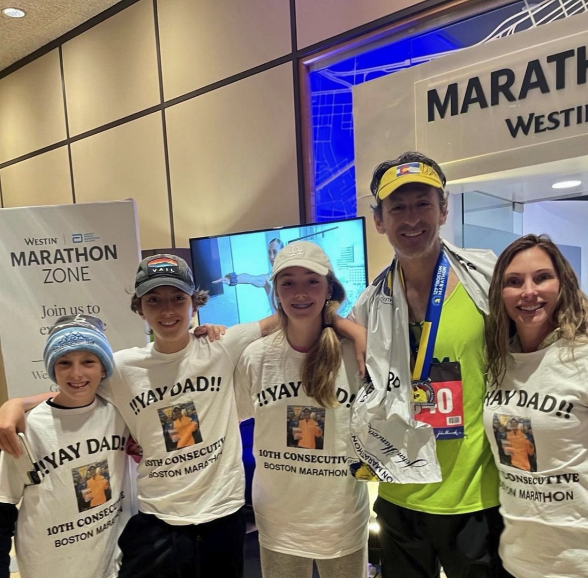 Dr. Vath standing with his family after successfully running a full marathon